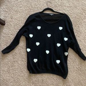 See through black sweater with white hearts